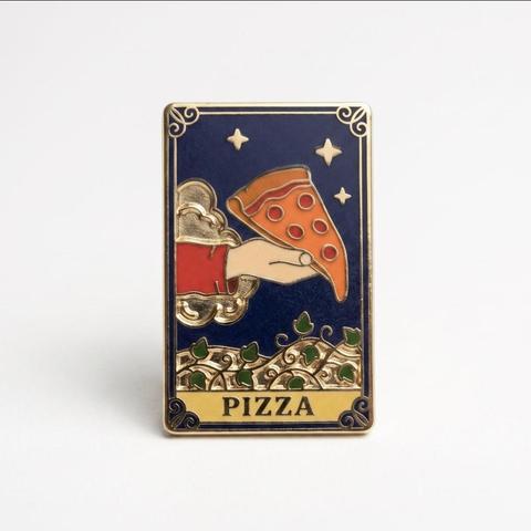 An enamel pin styled like a tarot card against a white background. The card features a dark blue night sky with stars, an arm emerging from a cloud to hold a slice of pepperoni pizza, and leafy vines along the bottom. A banner at the base reads "PIZZA".