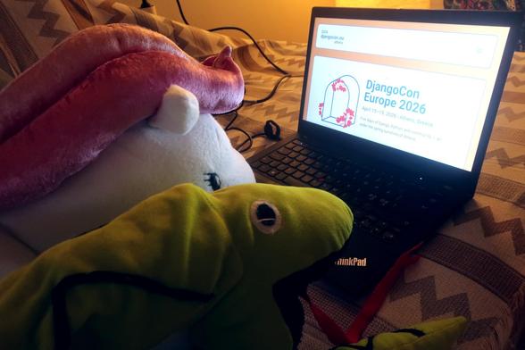 A photo of a magic pony with flying wing and a python looking at the website of DjangoCon Europe 2026